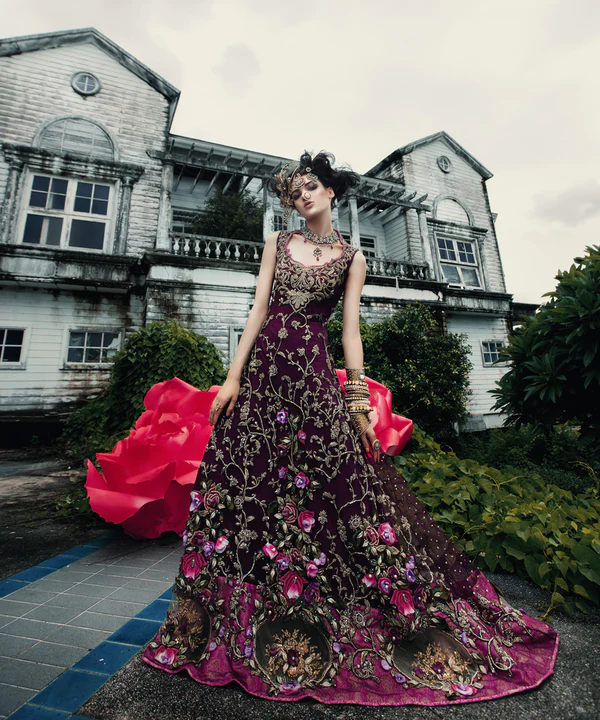 Enthralling aubergine gown with dull-gold zardozi hand embroidery smeared all over